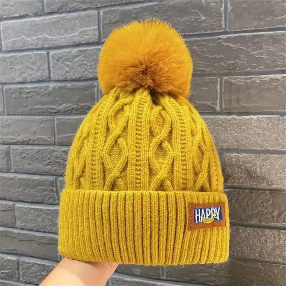 Bommelmütze mit Ohrenklappen – Warme Strickmütze für Damen im Winter